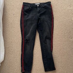 Black jeans with red stripe